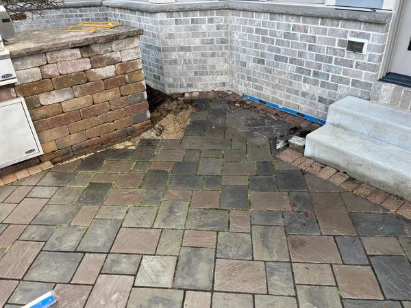 What a Failed Paver Patio Really Costs (And Why We Only Install Clear Stone Now)